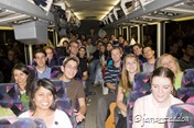 The joyful team on the bus in the evening