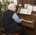 Bev Shea playing his little pump organ