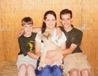 David, Esther and Jonathan had their picture taken with "a tame lion" at last year's traveling zoo.