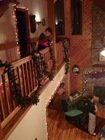 David diligently hanging the garland.