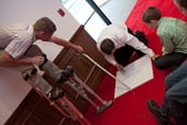 A few Duggars help cut the ceiling tiles.