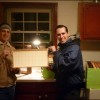 One Down … Five Hundred Ninety-Nine To Go! Michael and James with the first frame of finished honeycomb foundation, Wednesday, December 11