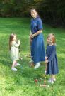 Gabriel, Esther, and Jewel play croquet